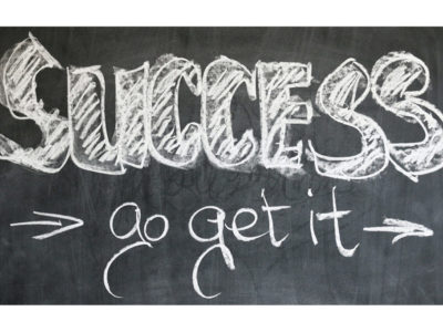 chalk board with "success - go get it" written